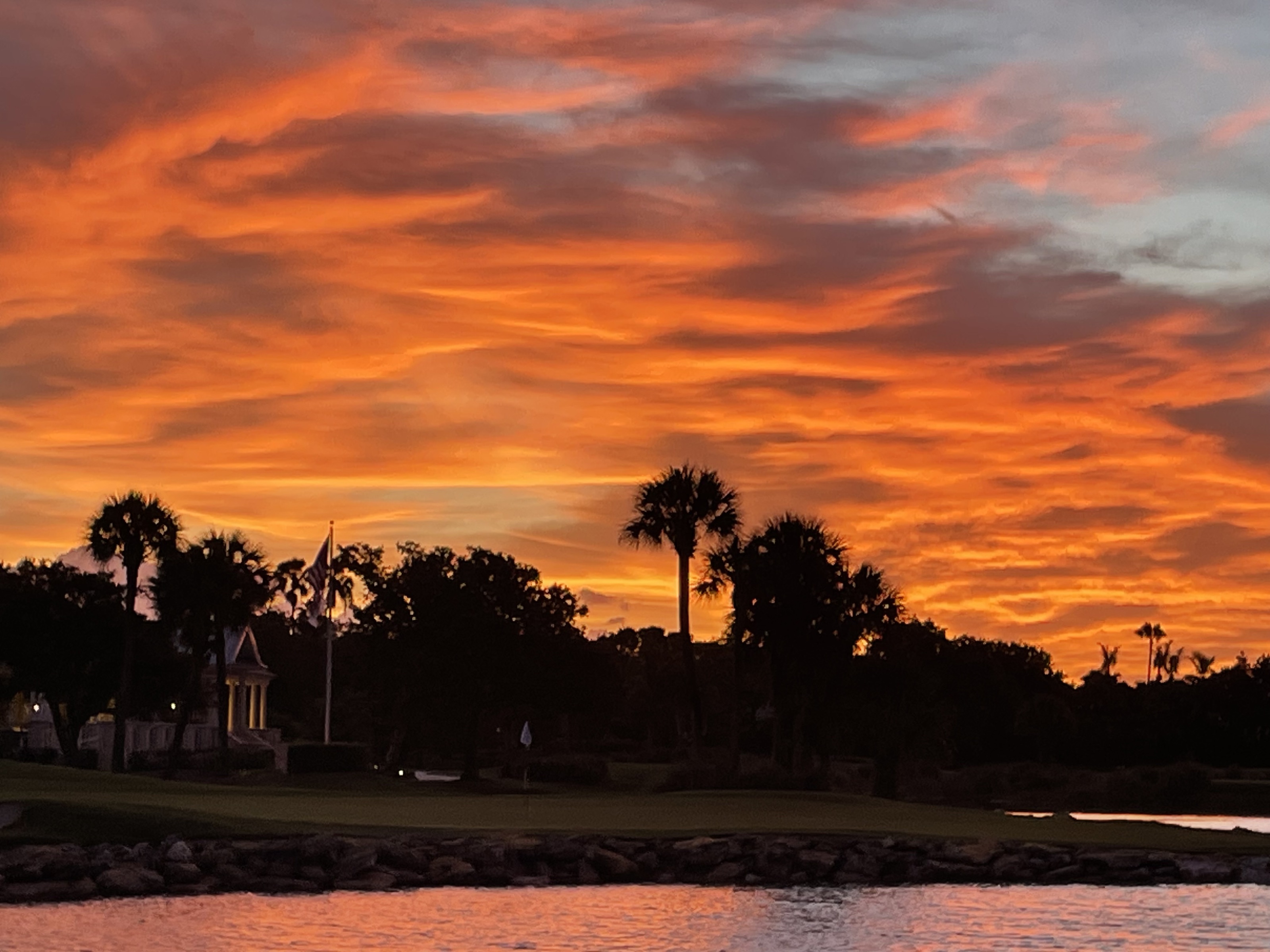 Sunrise over the lake and palms at Orchid Island, Vero Beach